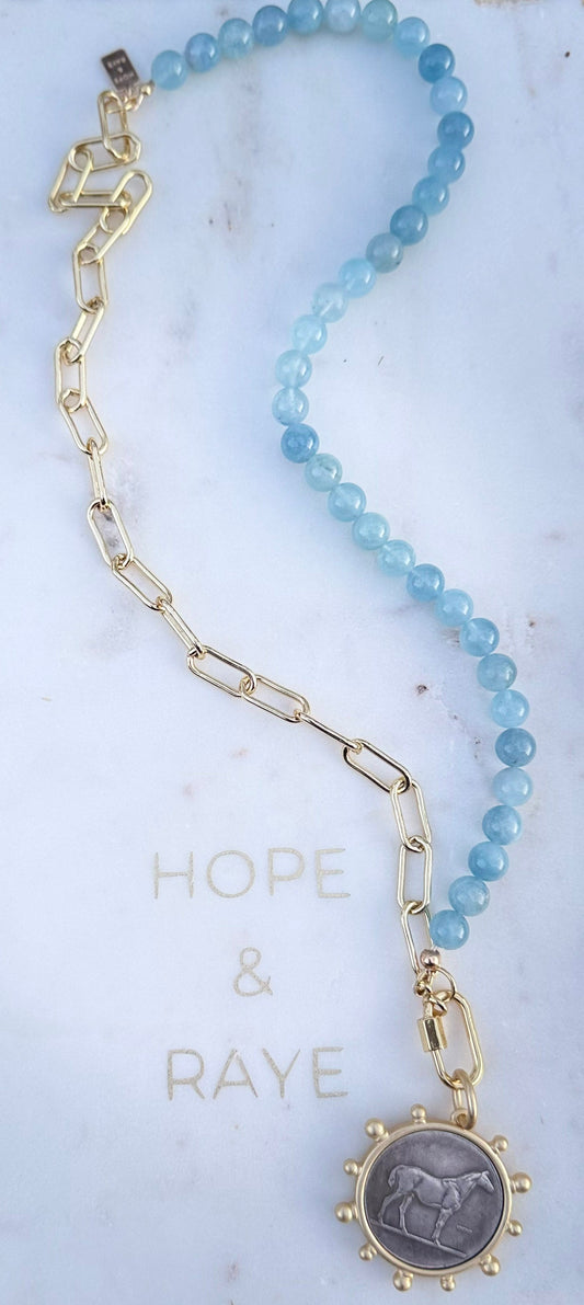 Horse pendant necklace with natural aquamarine and 18k gold-filled chain. 22inch necklace handcrafted in Atlanta by Hope and Raye.