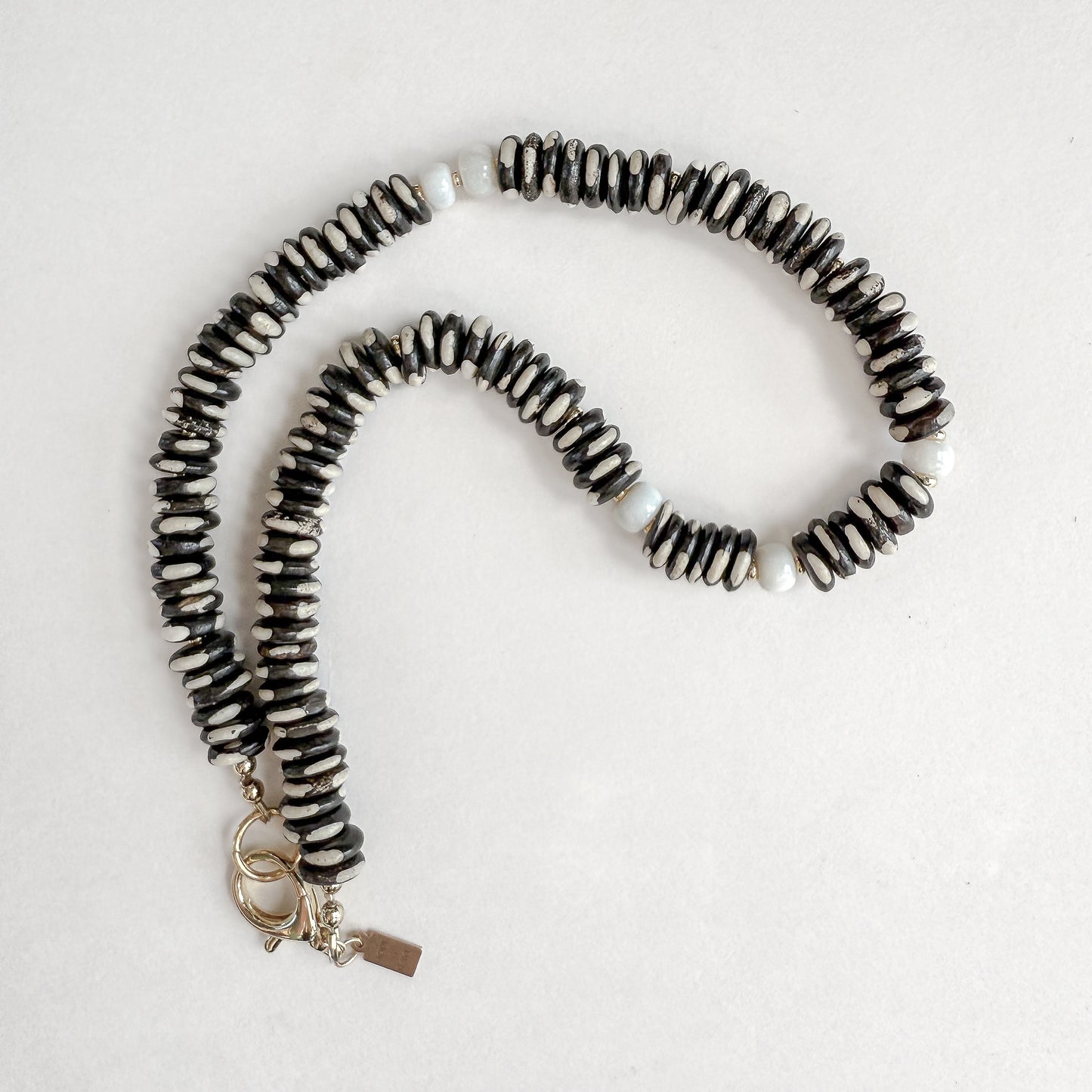 Dalmatian Jasper 17 inch Necklace with White Opal and Gold-Filled Clasp. Designed by Hope and Raye in Atlanta, GA.