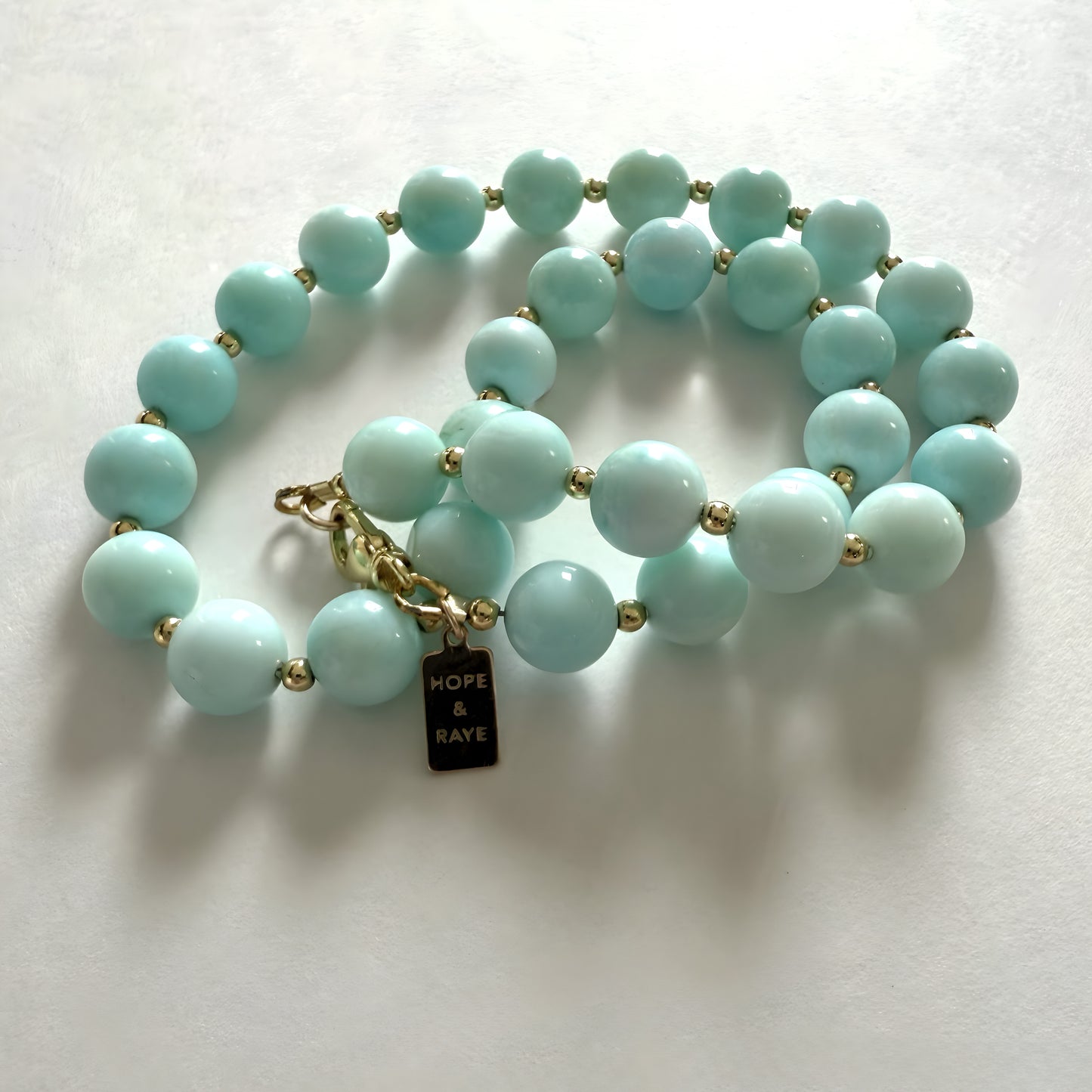 blue opal beaded necklace with gold clasp by hope and raye