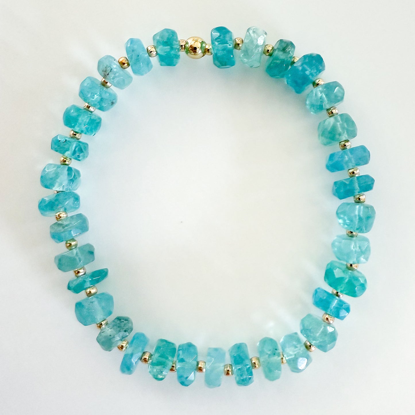 Tarnish resistant and gold filled bracelet handcrafted with natural blue apatite gemstones. Ships in a jewelry box with velvet pouch from Atlanta, Georgia.