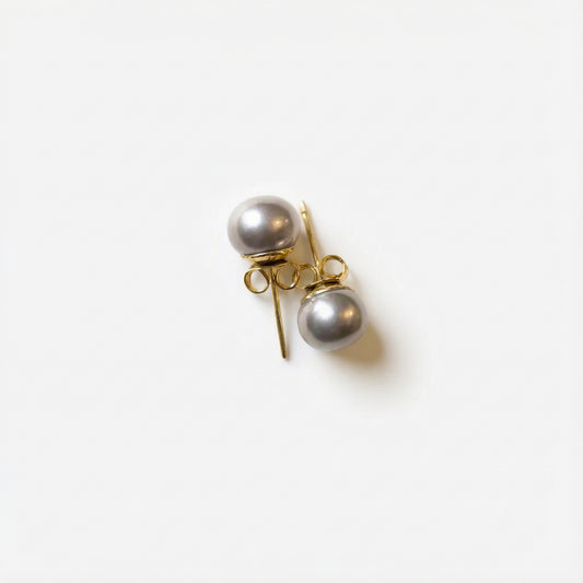 Hypoallergenic, natural, gray silver pearls with gold filled posts for daily wear. These earrings ship in gift ready packaging. Jewelry box and velvet pouch included.