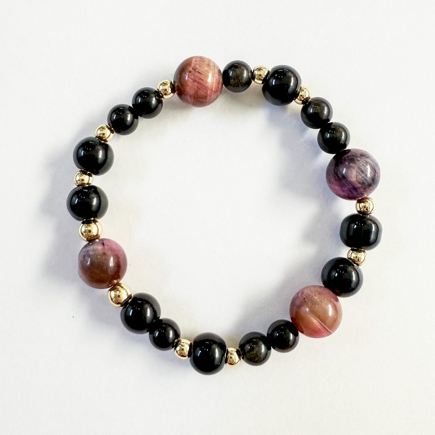 Black onyx, pink cats eye, gold beaded stretch bracelet. Handcrafted in Atlanta, GA USA.