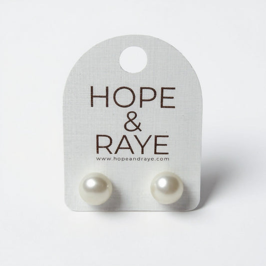 White pearl earrings with gold posts