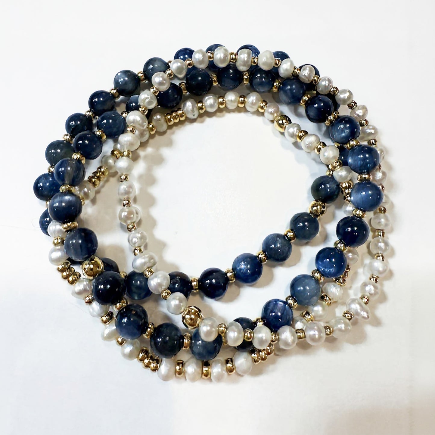 Kyanite gemstone bracelet stack with freshwater pearls by Hope and Raye. Stack of 4 bracelets.