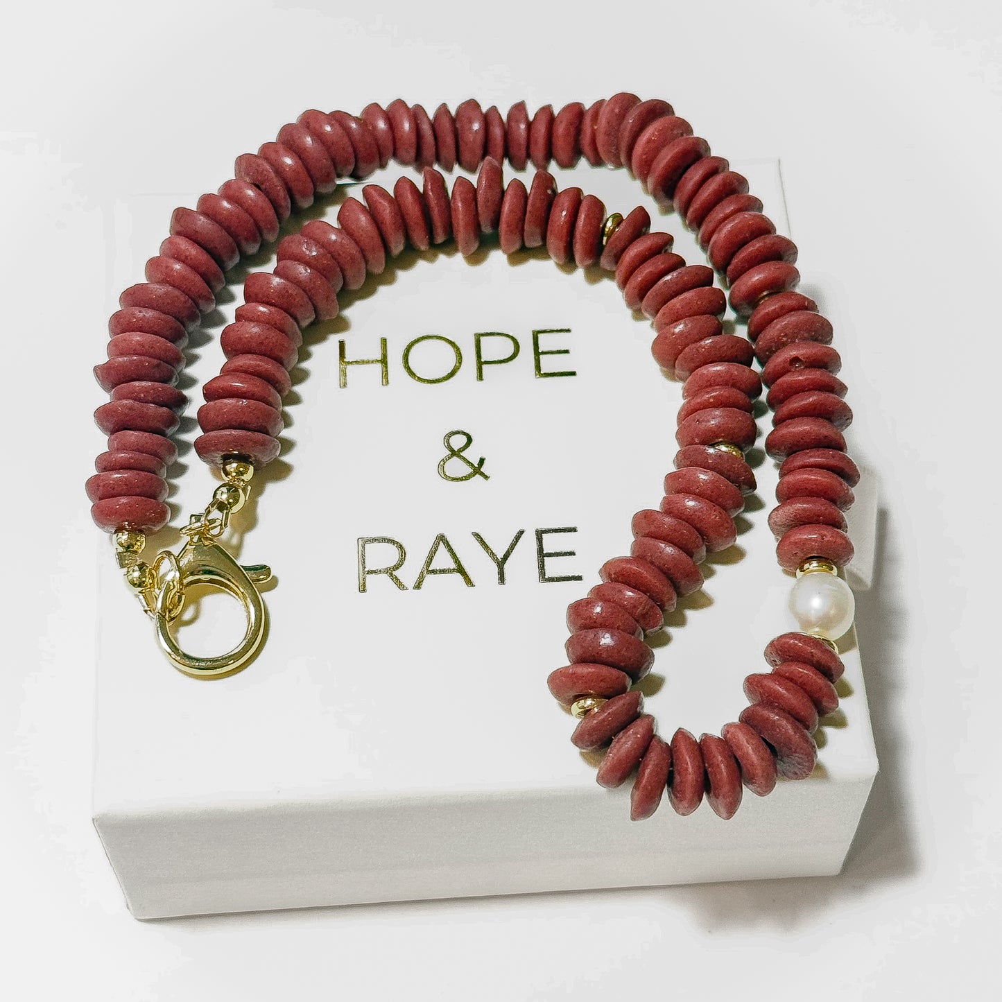 Maroon/Crimson Disc 16 inch necklace with gold discs, gold clasp and natural pearl. Perfect for gameday and a thoughtful holiday gift for the Alabama fan or Mississippi state fan. Handcrafted in Atlanta.