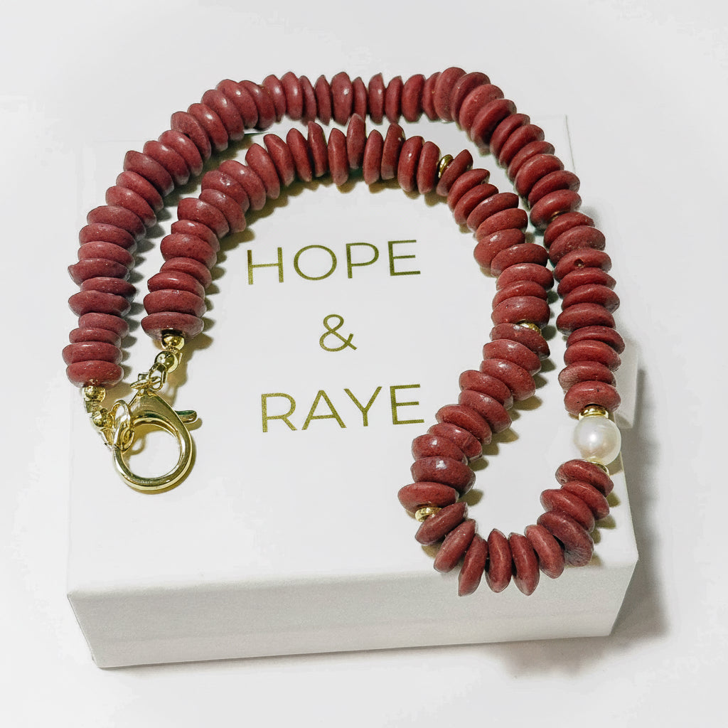 Maroon/Crimson Disc necklace with 18k gold discs, gold clasp and a large natural pearl at the center.