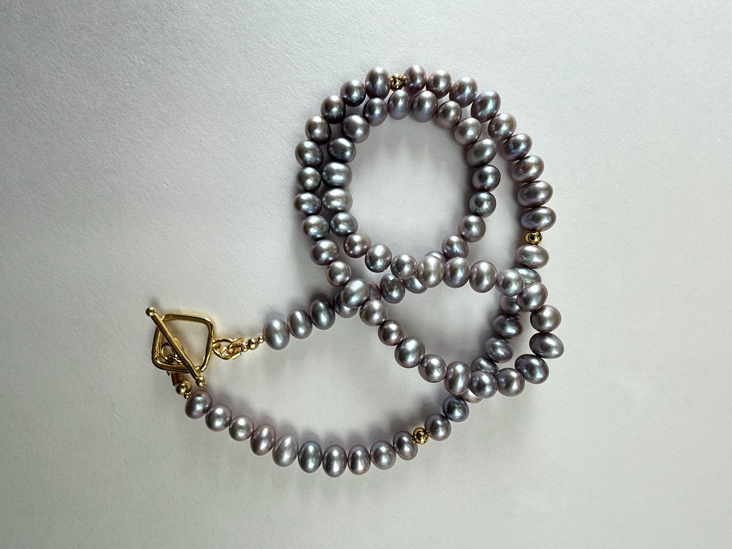 Peacock freshwater pearl necklace styled in loop with gold clasp – handmade 18-inch necklace by Hope & Raye