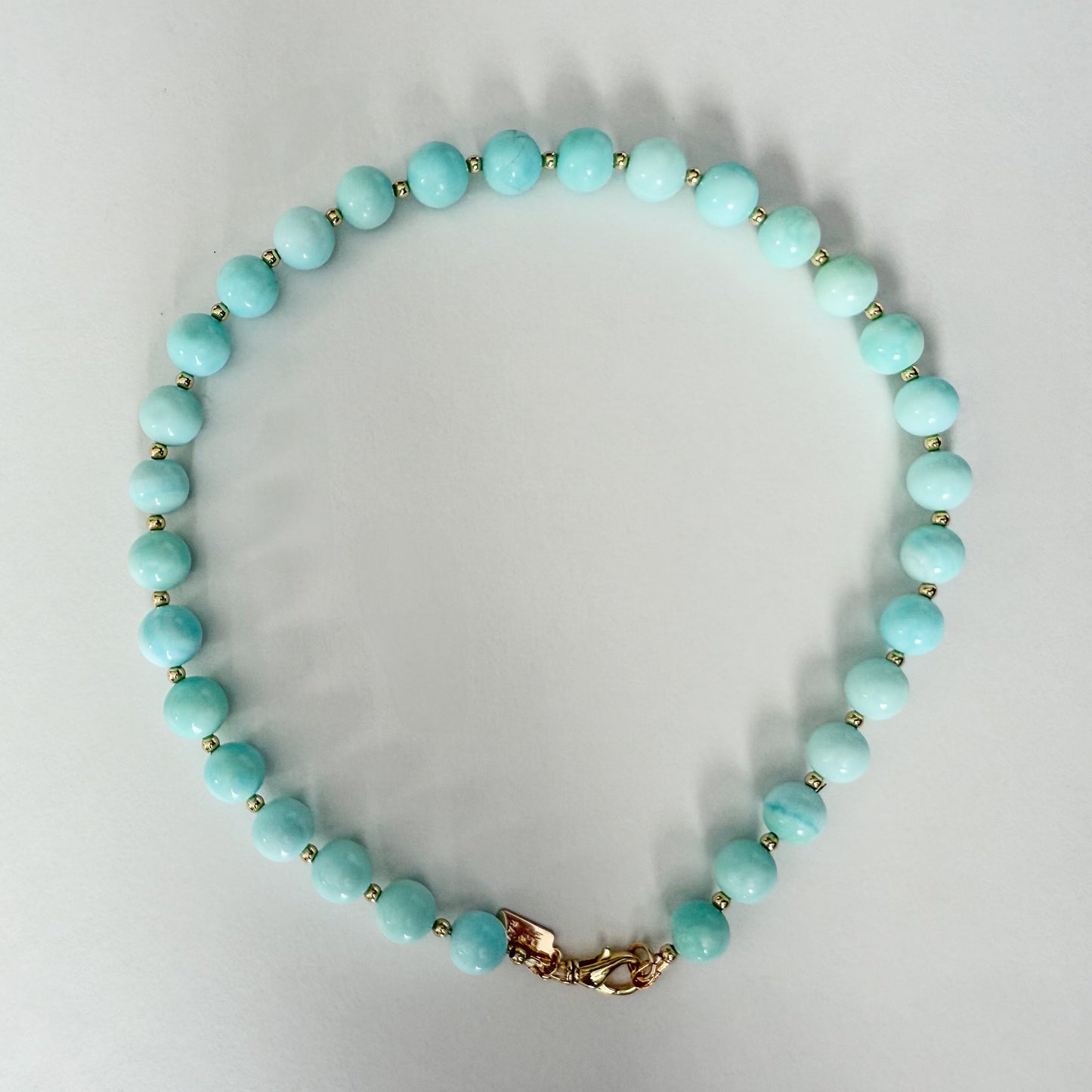 Blue opal necklace with gold beads and gold clasp by Hope and Raye