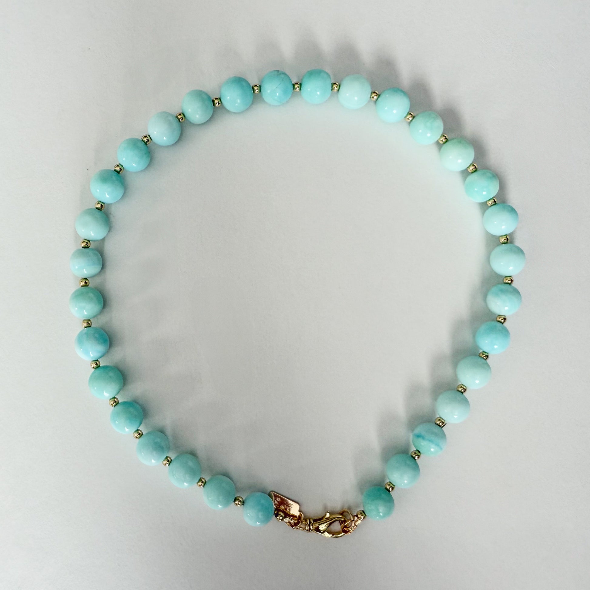 Blue opal necklace with gold beads and gold clasp by Hope and Raye