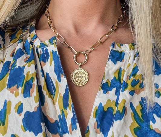 16 inch gold filled necklace with charm holder and 1 inch coin charm by Hope and Raye.￼