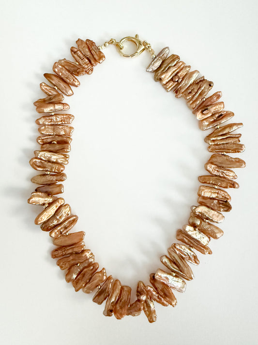 Natural golden brown stick pearl necklace 16 inches with gold clasp.