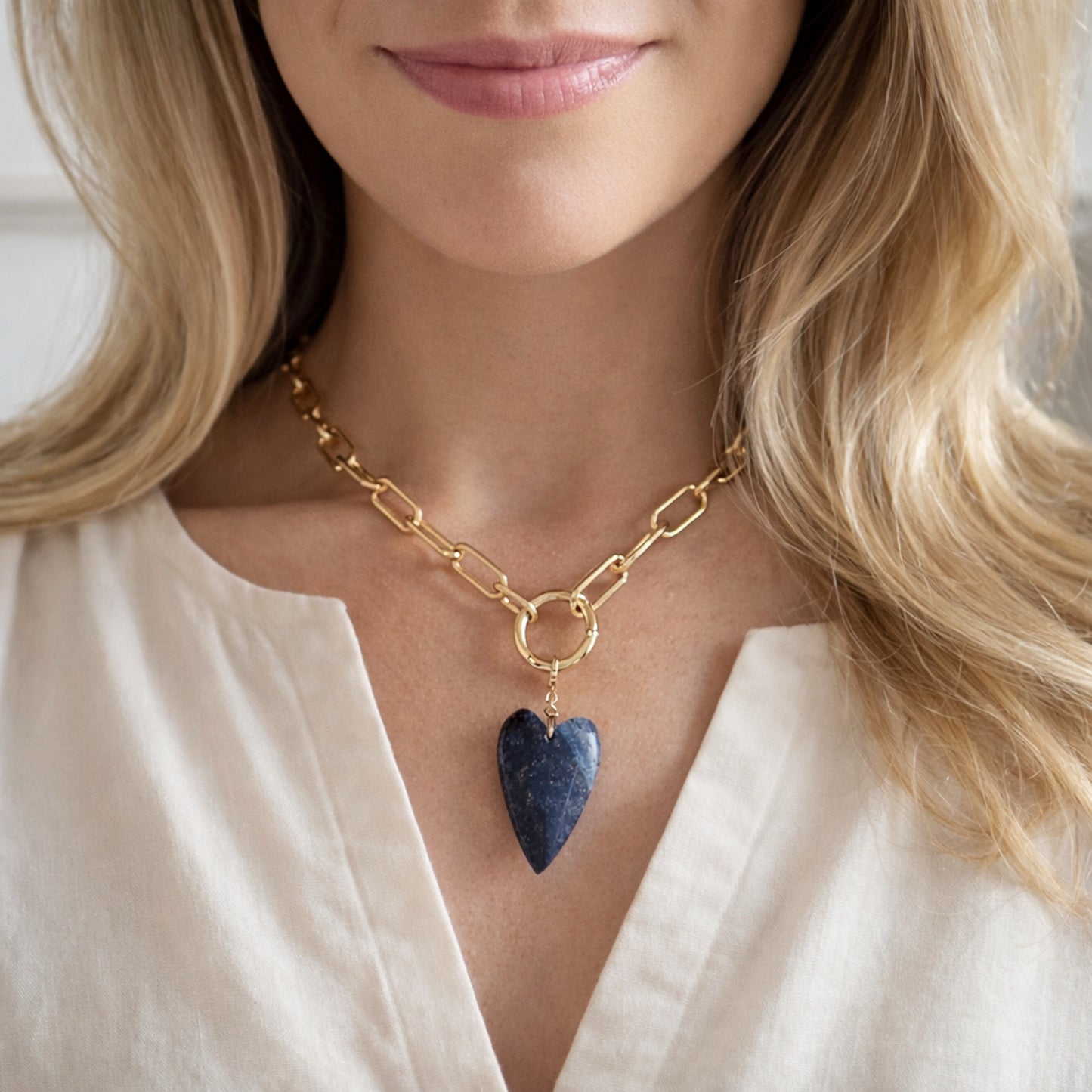 16 inch gold filled charm necklace with removable natural blue lapis gemstone heart charm. The charm is hand wrapped with 18k gold filled wire by HOPE and RAYE in Atlanta. 