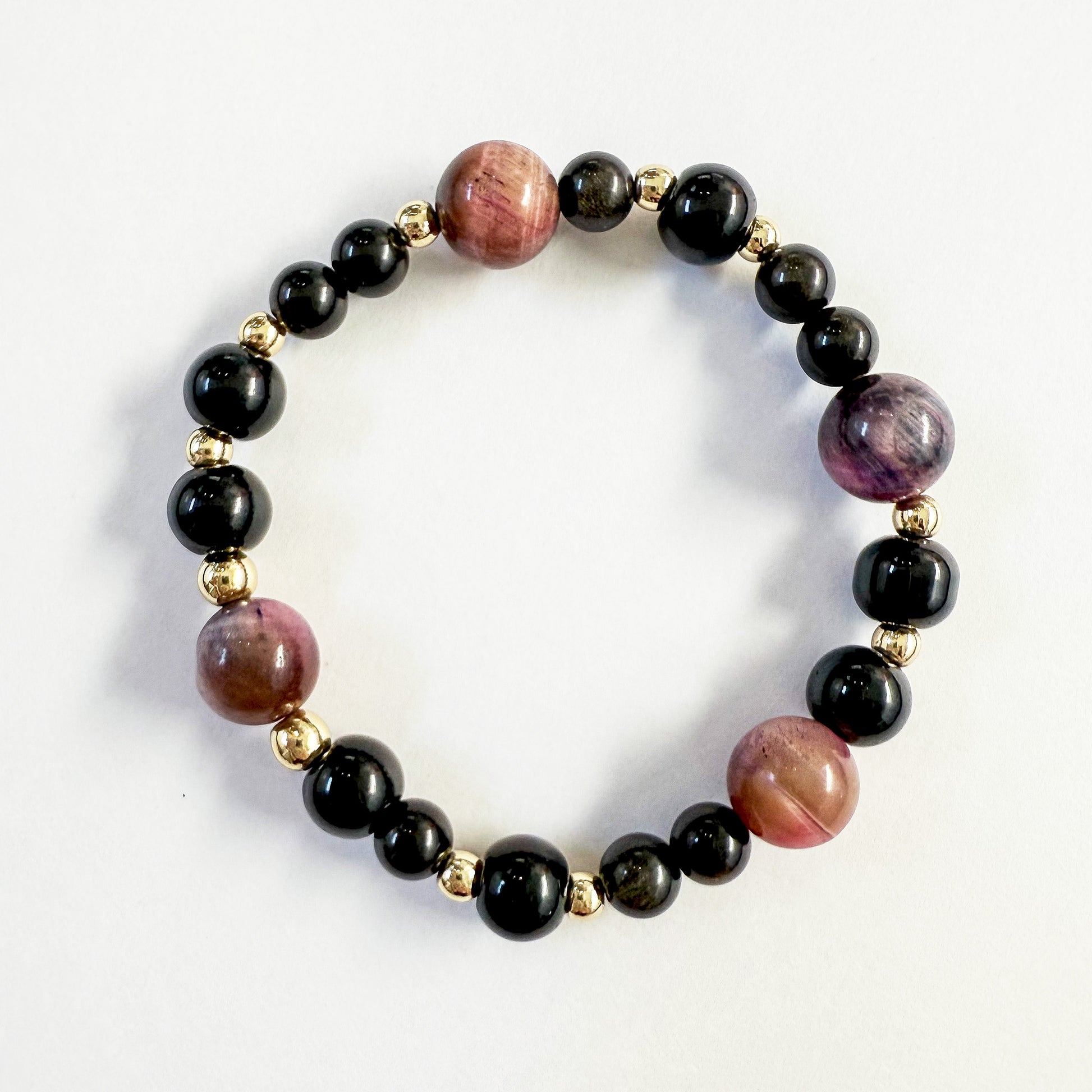 Black onyx, pink cats eye, gold beaded stretch bracelet. Handcrafted in Atlanta, GA USA.
