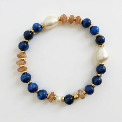 orange and blue stretch bracelet with pearl and gold