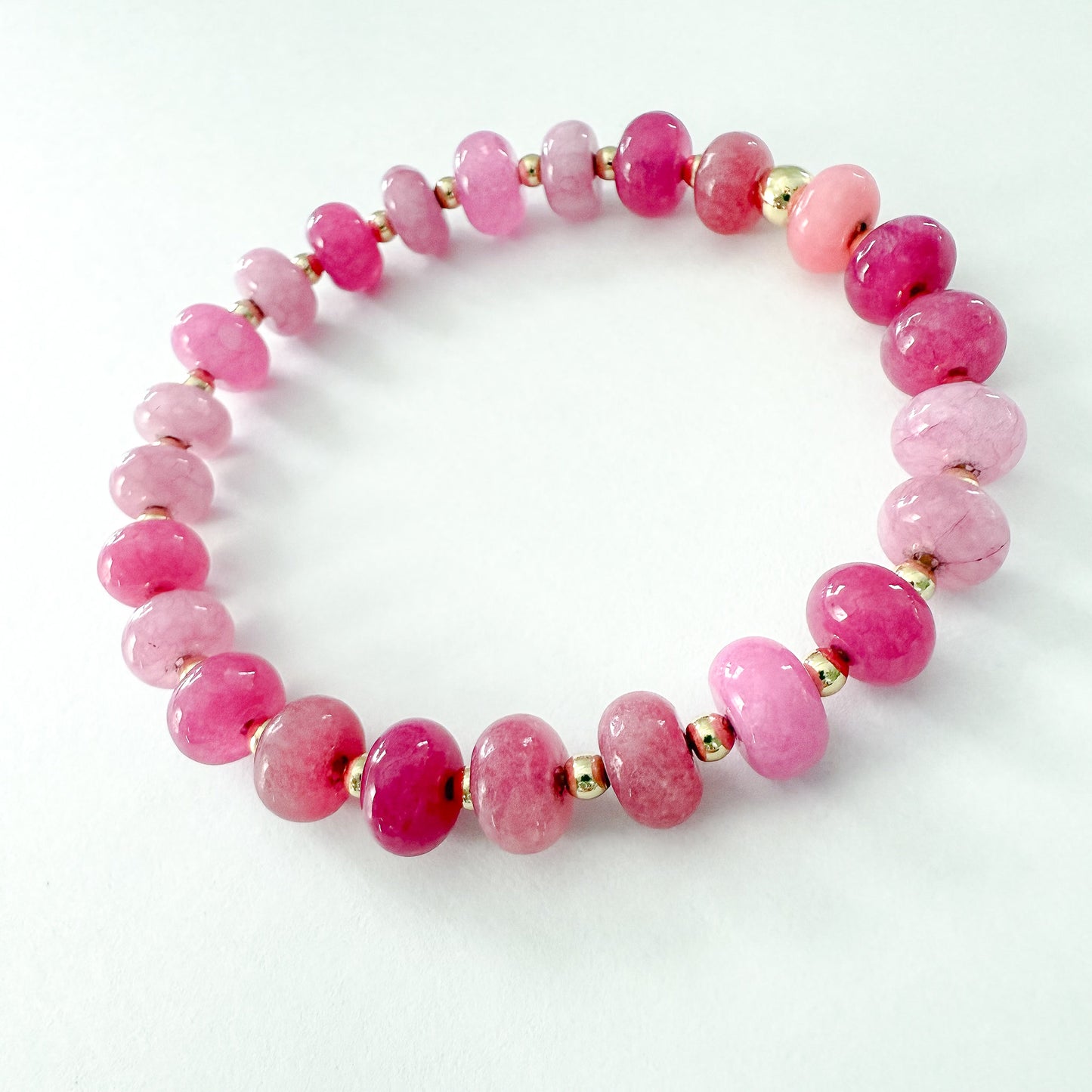 P!nk quartz and Jade with gold beaded stretch bracelet. Handcrafted in Atlanta by Hope and Raye. ￼