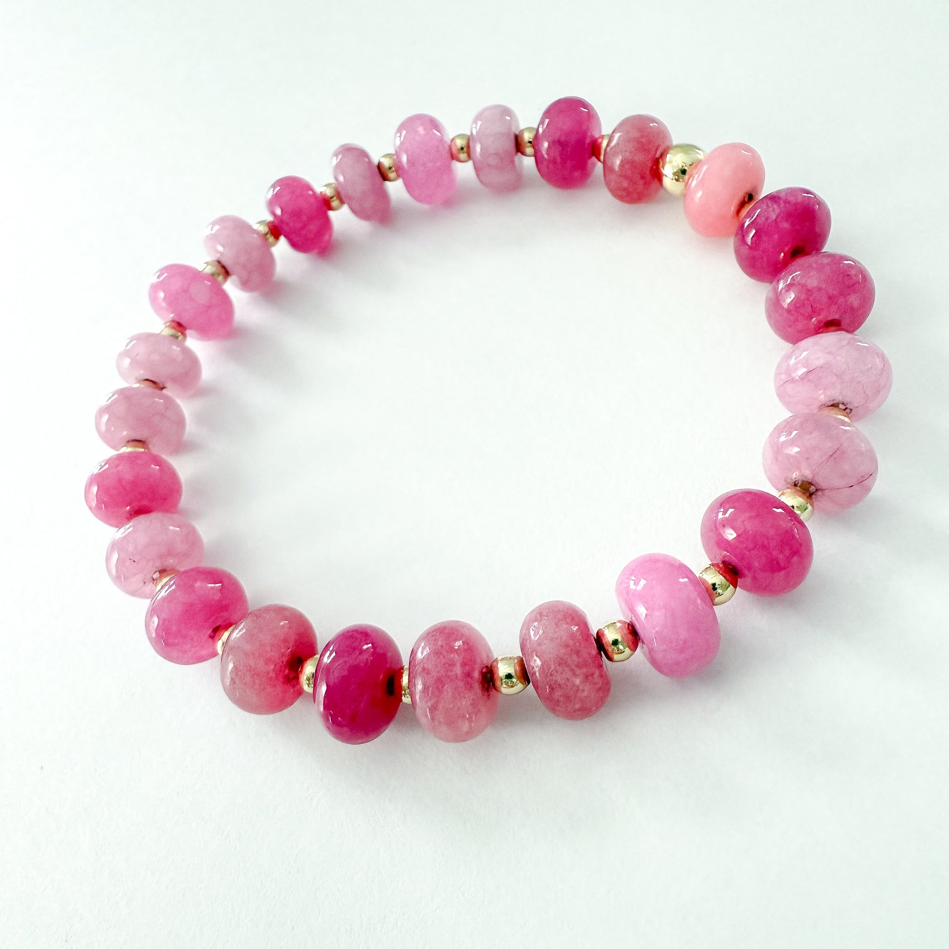 P!nk quartz and Jade with gold beaded stretch bracelet. Handcrafted in Atlanta by Hope and Raye. ￼