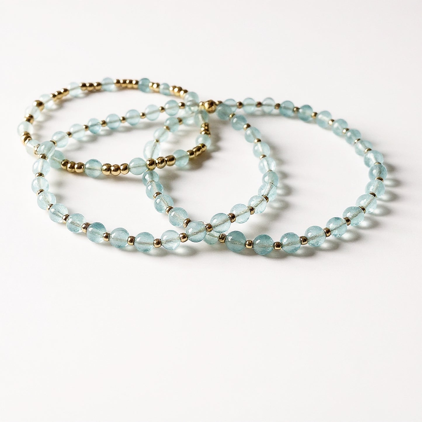 Dainty aquamarine and gold bracelet set. Natural aquamarine and gold filled everyday bracelet trio stack.