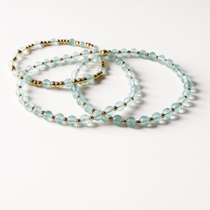 Dainty aquamarine and gold bracelet set. Natural aquamarine and gold filled everyday bracelet trio stack.