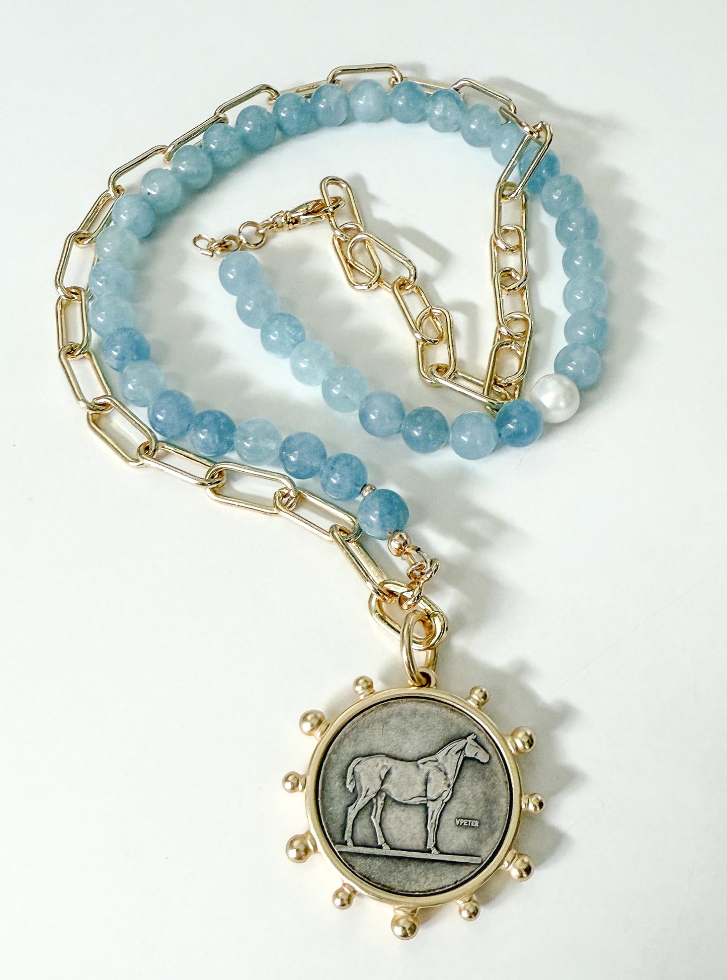 Natural aquamarine and gold chain necklace with horse pendant. Perfect holiday gift for horse lover or equestrian. Handcrafted with attention to detail by Hope and Raye in Atlanta Georgia. 