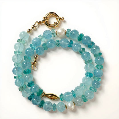 Aquamarine and apatite blue beaded necklace with gold fish charm and gold-filled spring clasp 