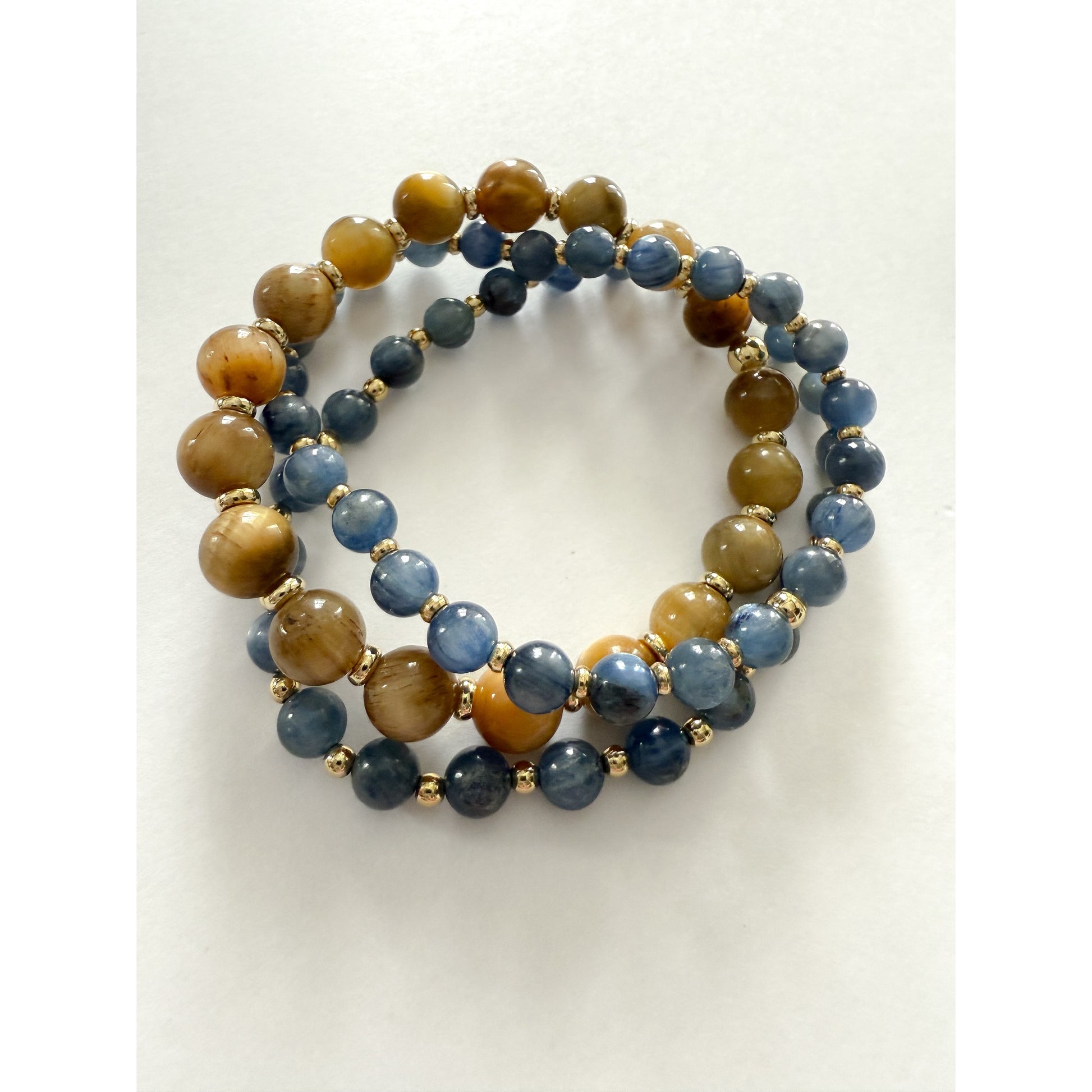 Blue kyanite and tigers eye stretch bracelet set with gold filled beads by HOPE & RAYE.