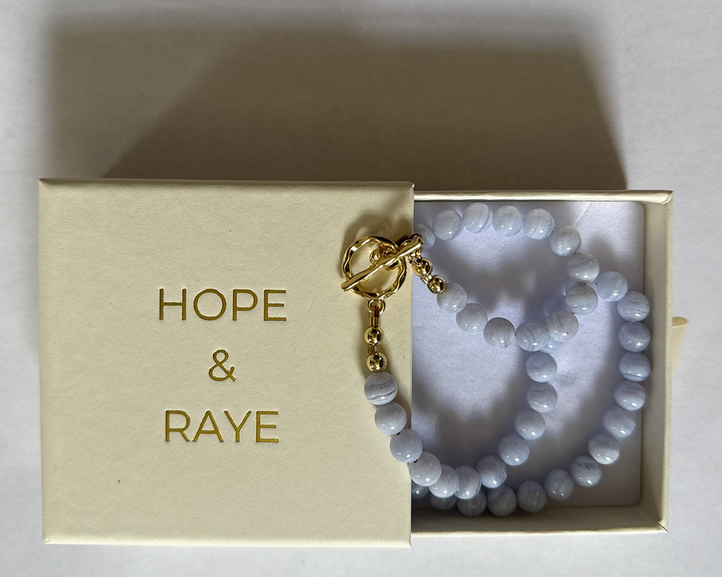 blue agate beaded necklace in gifting packaging by hope and raye