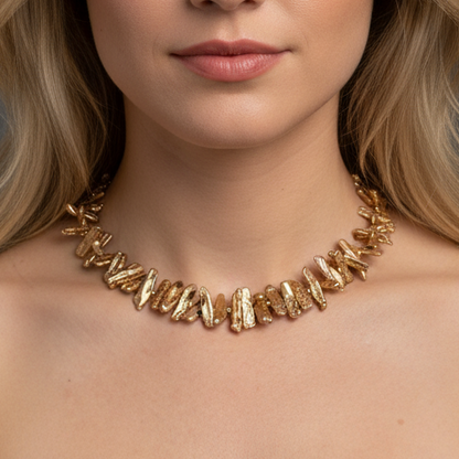 Woman wearing goledn brown stick pearl necklace with gold-filled beads and clasp.