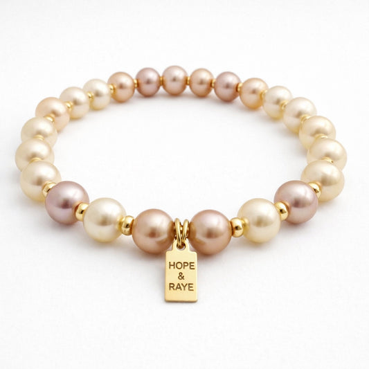 Pink pearl bracelet with gold beads. Handcrafted in Atlanta,GA.