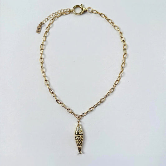 Fish charm on gold dainty adjustable chain with large lobster claw gold- filled clasp by Hope and Raye. 