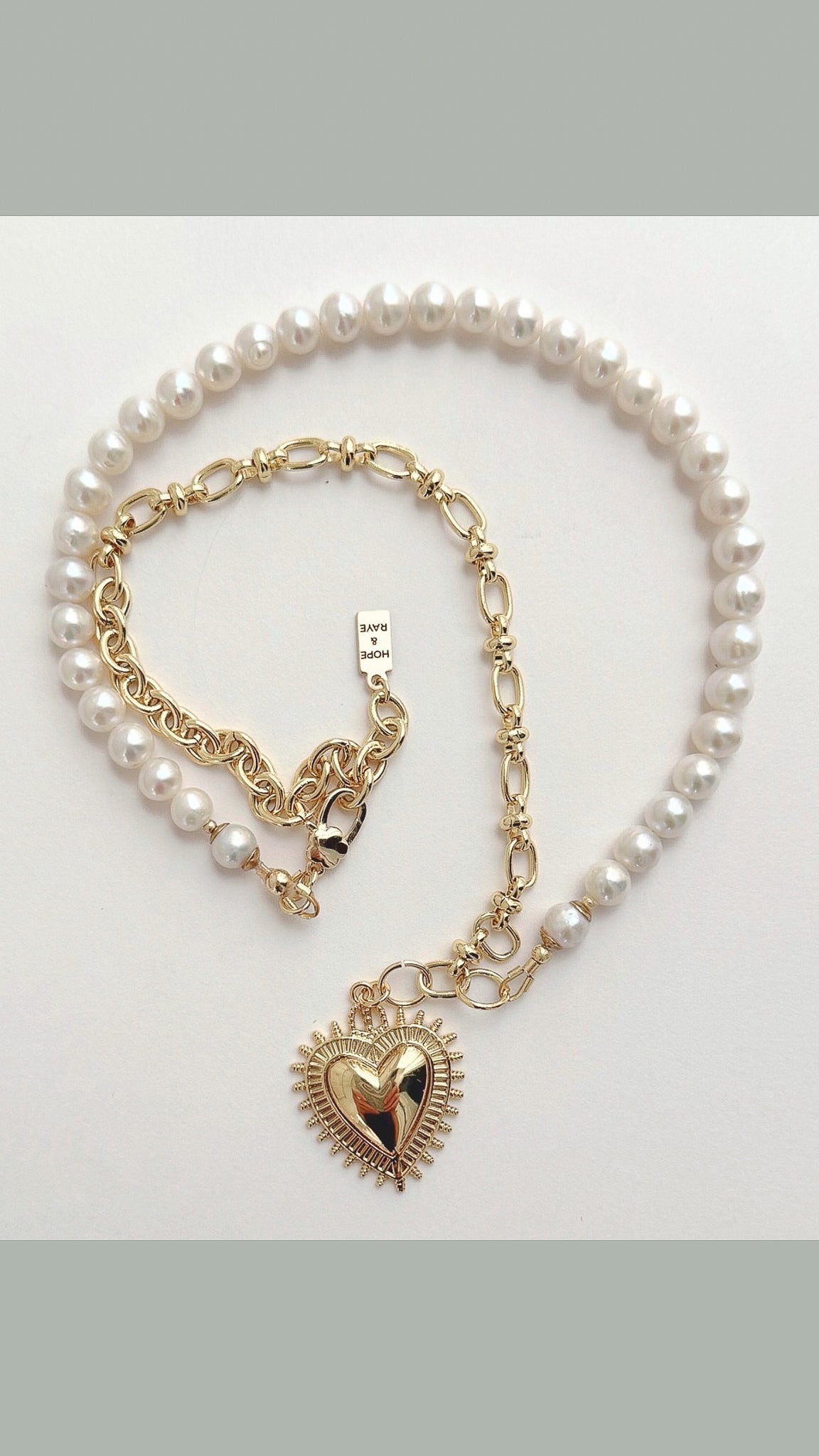 Gold heart charm on split design necklace. 1/2 natural freshwater pearl other half 18 carat gold filled chain. Handcrafted in Atlanta by Hope and Raye. Makes a perfect holiday necklace gift for her.
