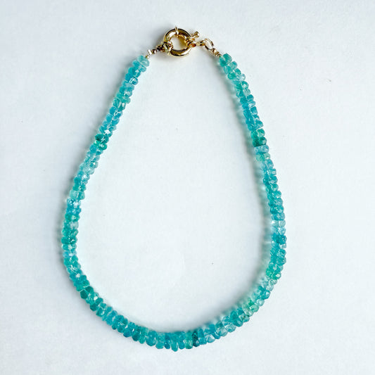 Handcrafted natural turquoise blue gemstone beaded 16 inch with gold spring clasp. Versatile necklace wear clasp in front or back. Designed by Hope and Raye in Atlanta Georgia.