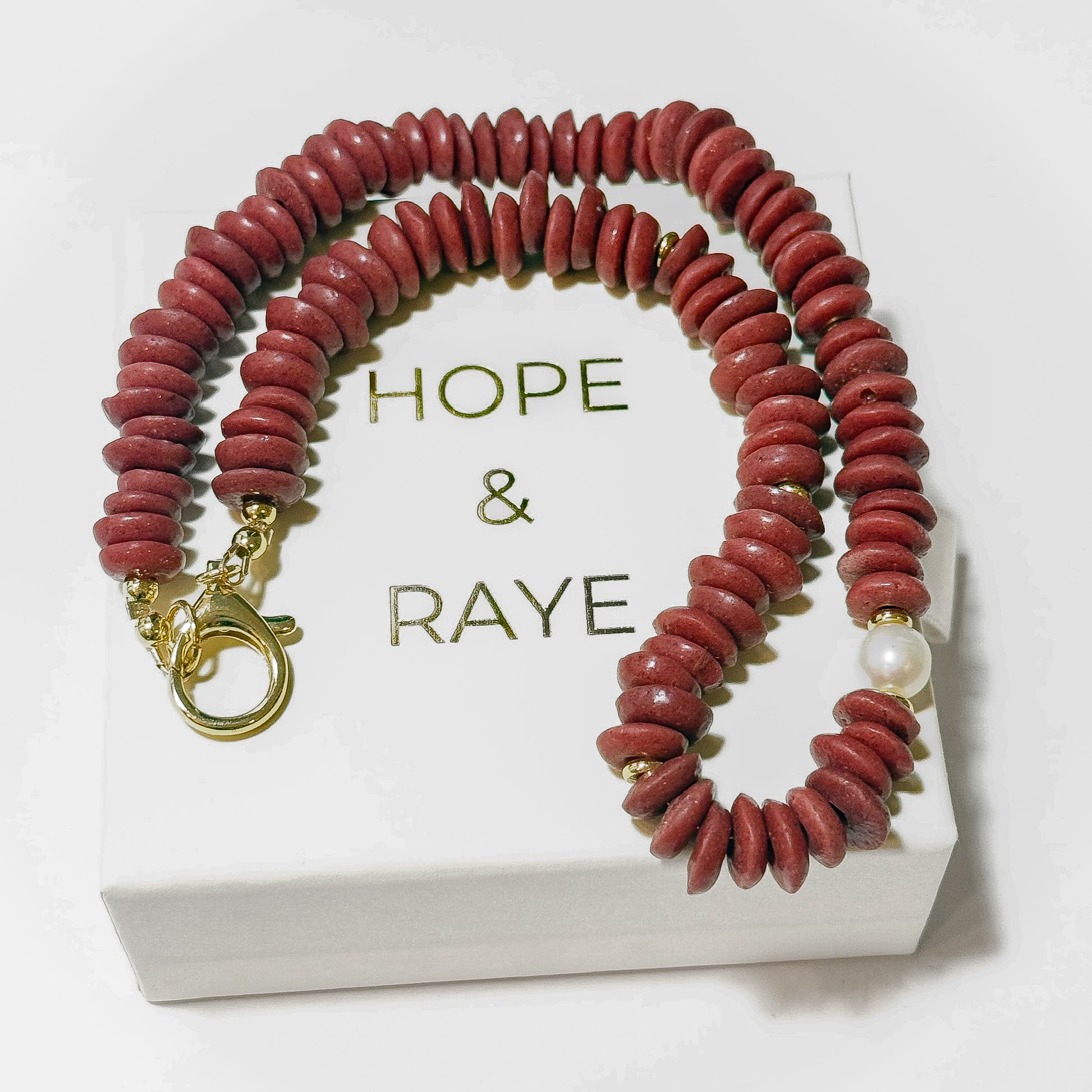 Maroon/Crimson Disc 16 inch necklace with gold discs, gold clasp and natural pearl. Perfect for gameday and a thoughtful holiday gift for the Alabama fan or Mississippi state fan. Handcrafted in Atlanta. 