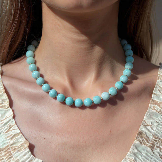Model wearing blue beaded opal short necklace with gold filled beads