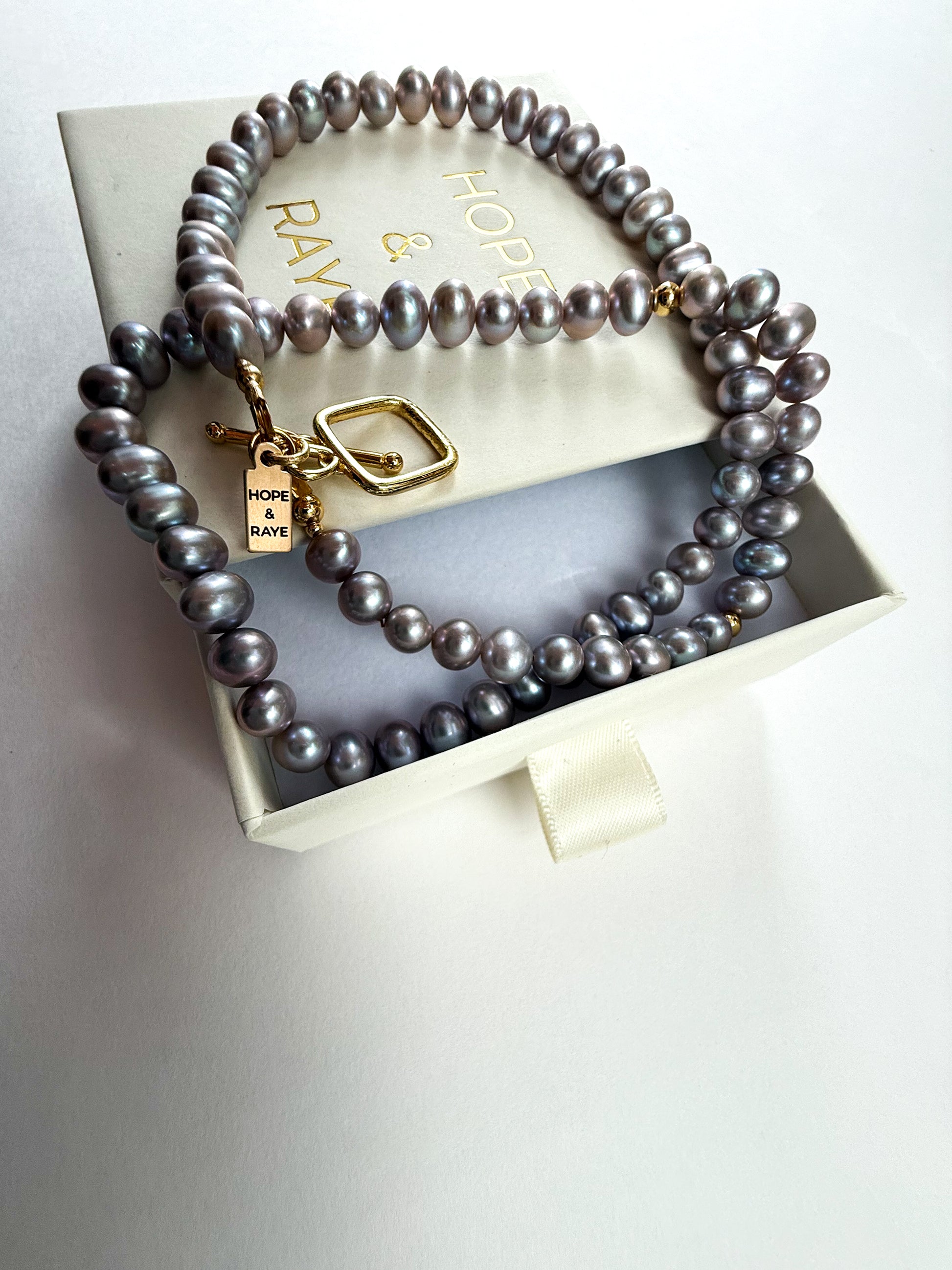 Necklace with peacock freshwater pearls displayed in gift-ready pull-out box – Hope & Raye