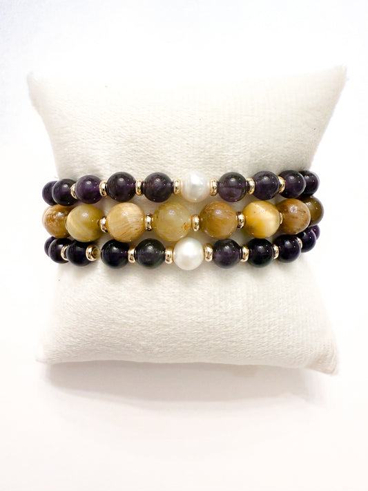 Pre-designed  3-bracelet stack featuring natural amethyst, freshwater pearls, and tiger’s eye gemstones with smooth round stretch beads.