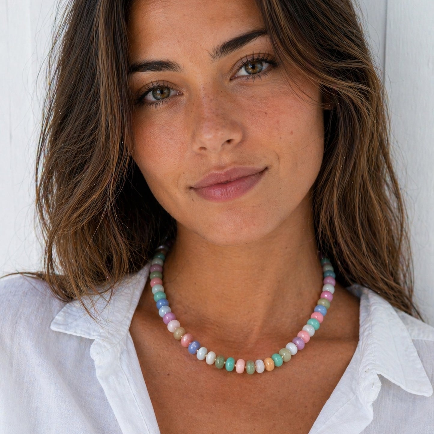 woman wearing a colorful beaded gemstone necklace