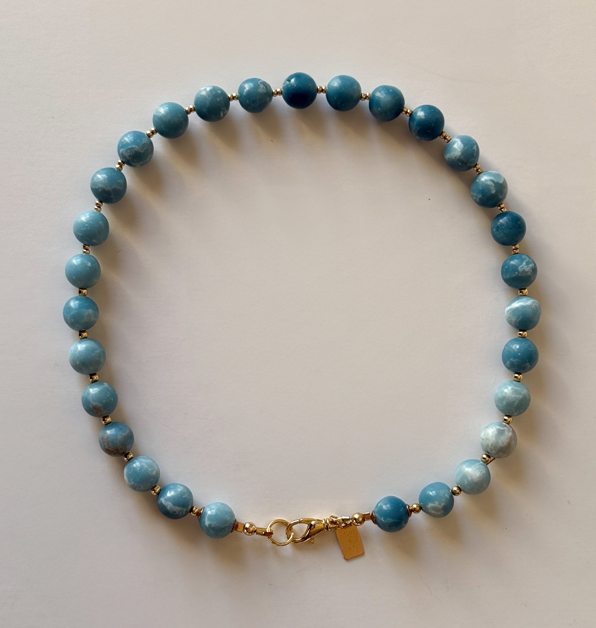 Larimar beaded necklace with gold class handcrafted in Atlanta by Hope and Raye￼