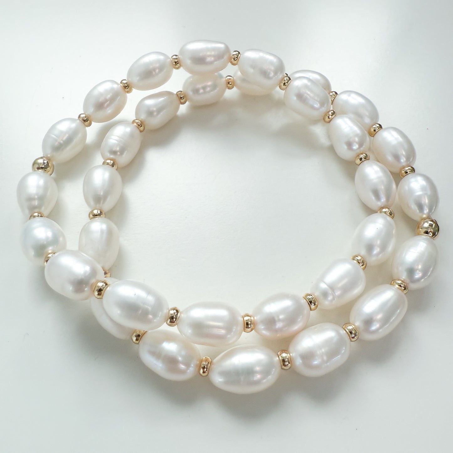 Two white freshwater pearl bracelets with 18K gold filled beads between pearls