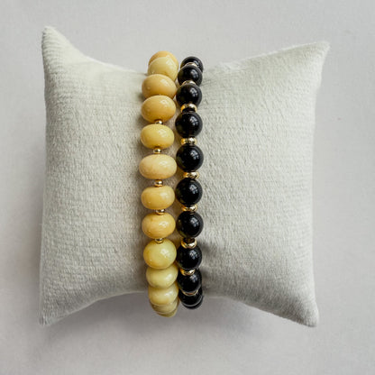 Yellow opal with 18k gold beaded bracelet. Black Falcon’s eye beaded bracelet with 18k gold filled discs. A pre-designed beaded bracelet pair for gifting. 